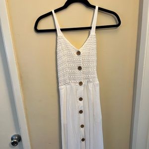 White dress with buttons and open back with a tie